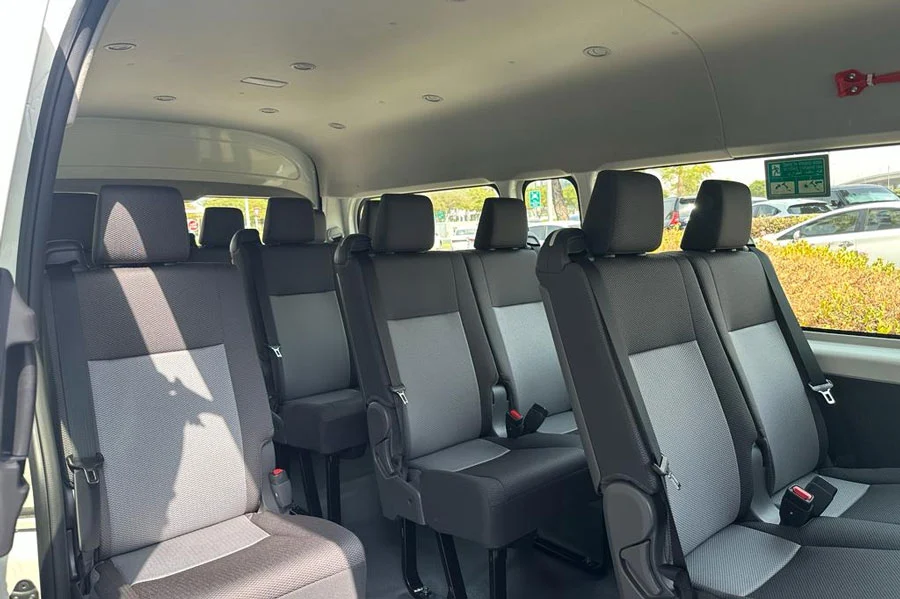Spacious Comfort:
Relaxing Front Seats in the Toyota Minibus.