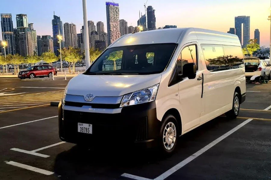 Toyota Minibus Cruising the Road: Perfect for Group Adventures (UAE).